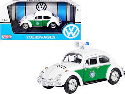 Carro 1:24 Volkswagen Beetle Policia de Alemania 14a+